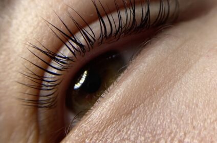 close up of a person's eye with long eyelashes